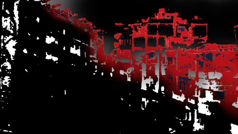 The image shows an abstract, high-contrast scene with a combination of black, white, and red colors. The shapes appear to be a mix of geometric forms and irregular patterns, possibly representing buildings or an urban landscape.