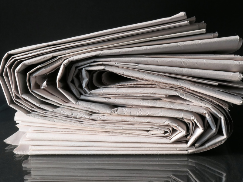Several newspapers rolled up