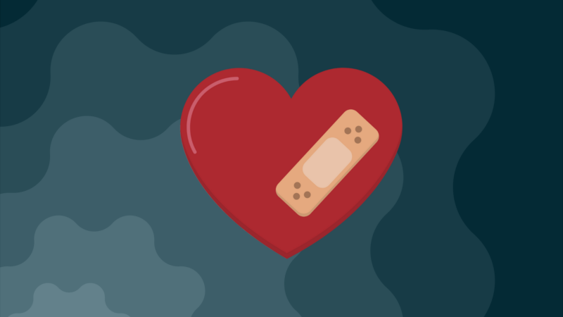 The image shows a red heart with a beige band-aid on it, set against a dark, abstract background.