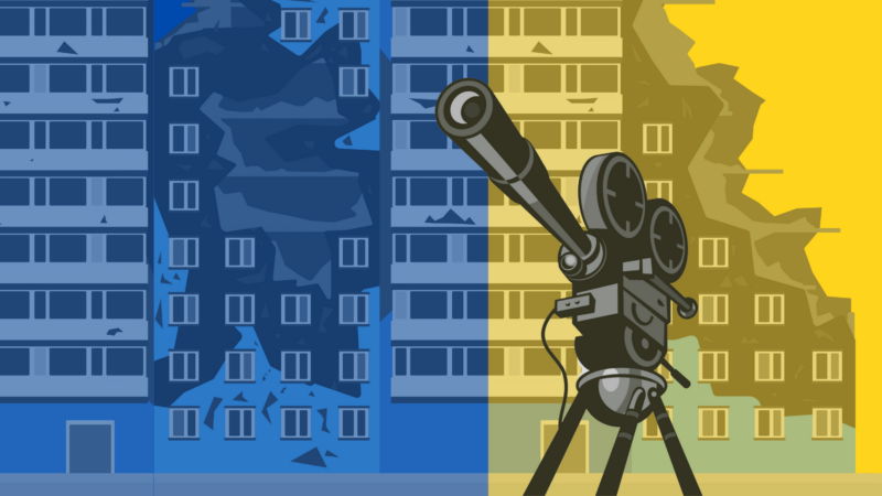 The image shows a stylized illustration of a film camera on a tripod in the foreground, with two buildings in the background. The buildings are depicted in blue and yellow colors, with the blue building on the left and the yellow building on the right. The buildings appear to be damaged or partially destroyed.