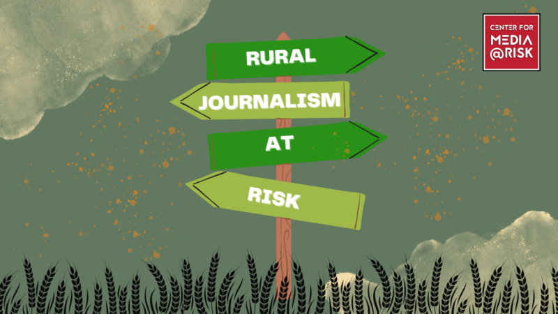 The image shows a signpost with three green directional arrows pointing to the right. The arrows are labeled "RURAL," "JOURNALISM," and "AT RISK." The background features a cloudy sky and tall grass at the bottom. In the top right corner, there is a red box with white text that reads "CENTER FOR MEDIA @ RISK."
